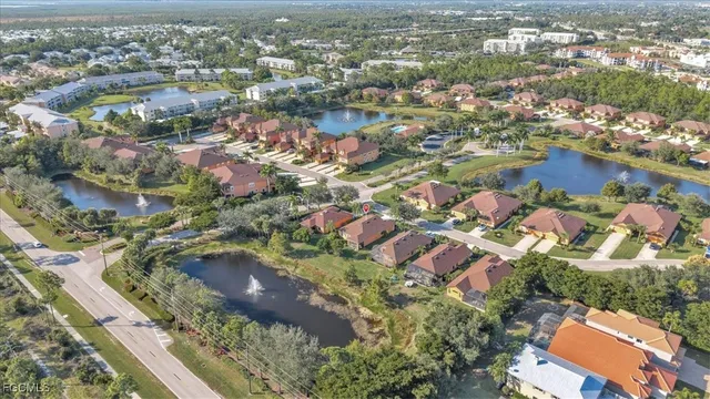 an aerial view of residential houses with city view
