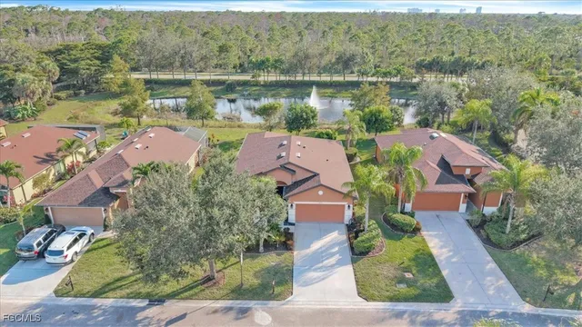 an aerial view of a house with a lake view