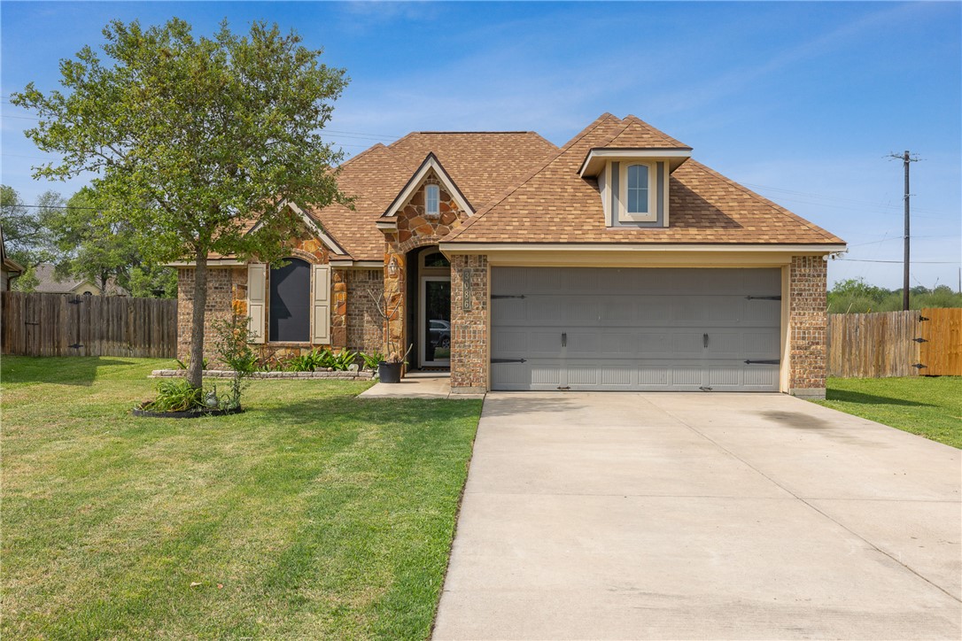 3086 Positano Loop Bryan, TX 77808 - Photo 1 of 1 a front view of a house with a yard