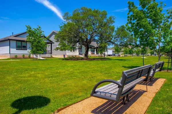 a view of a two chairs in a yard