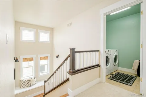 a view of livingroom with wooden floor and staircase