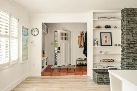 a living room with furniture and a table