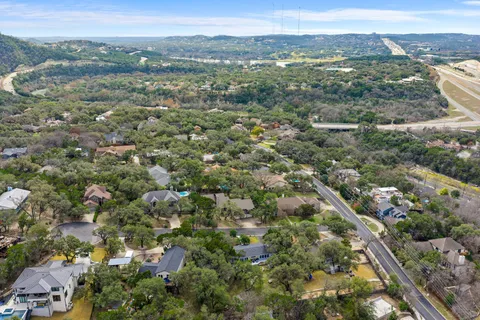 an aerial view of town with residential houses with outdoor space and trees
