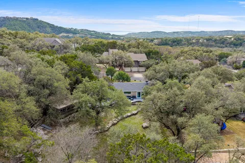 an aerial view of houses with yard