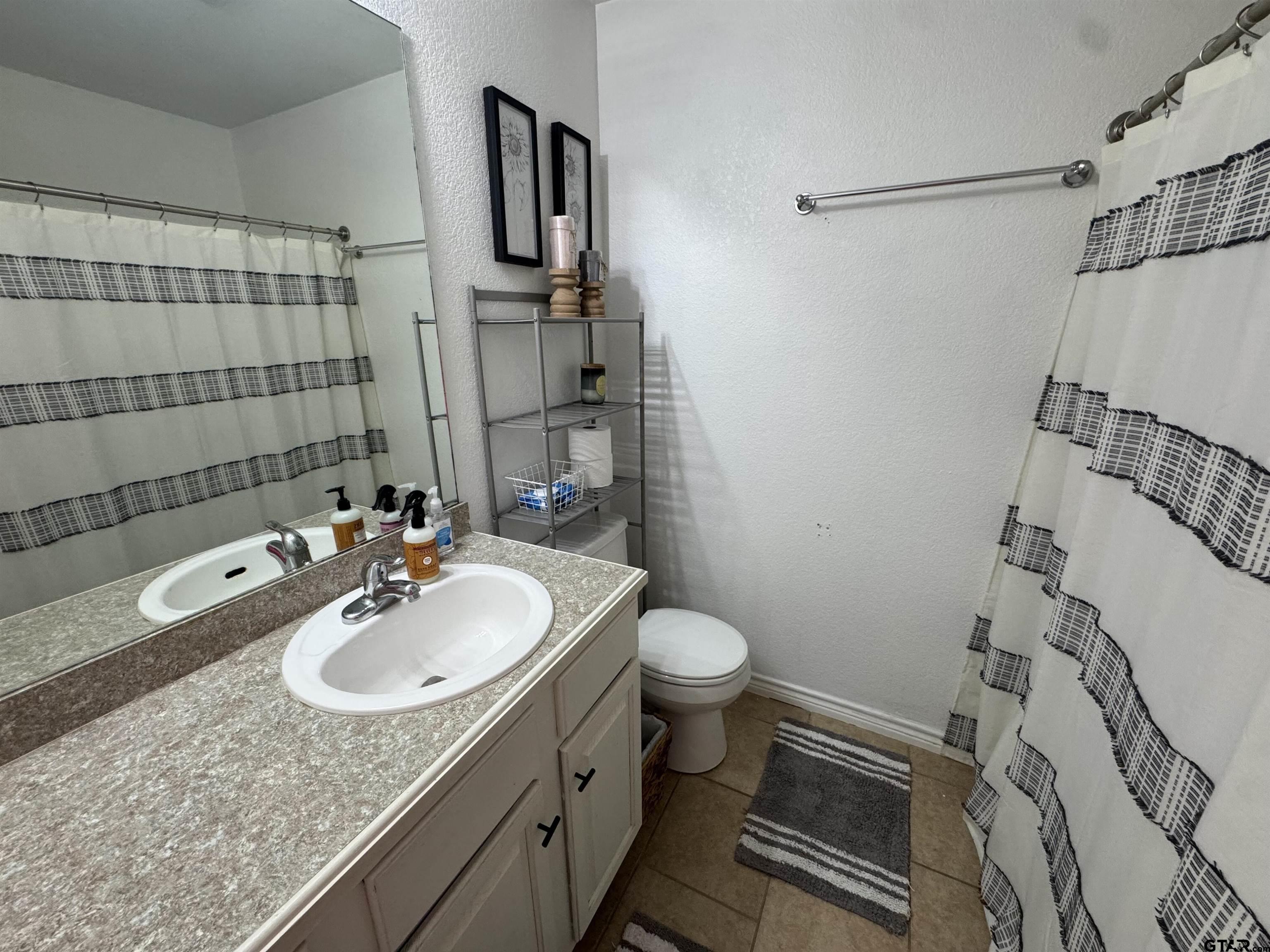 508 County Road 2147 Troup, TX 75789 - Photo 17 of 24 a bathroom with a sink toilet and shower