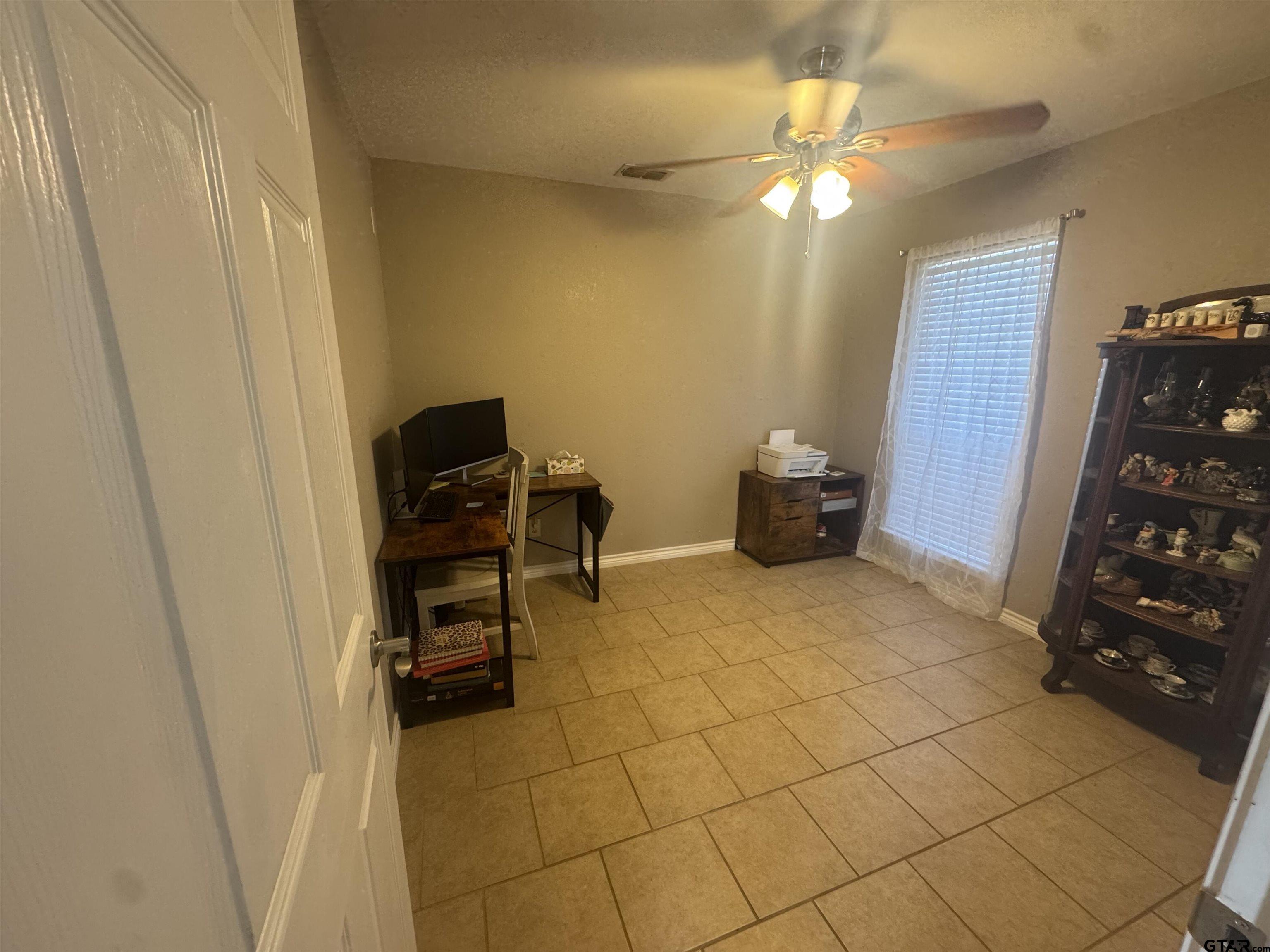 508 County Road 2147 Troup, TX 75789 - Photo 19 of 24 a bedroom with a bed and a chair