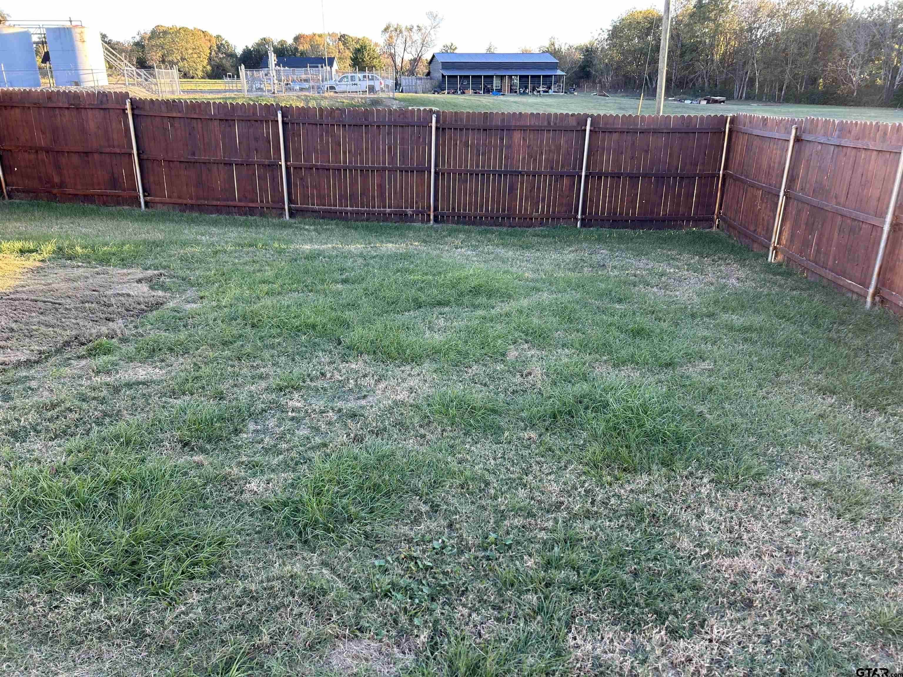 508 County Road 2147 Troup, TX 75789 - Photo 20 of 24 a view of a backyard with wooden fence