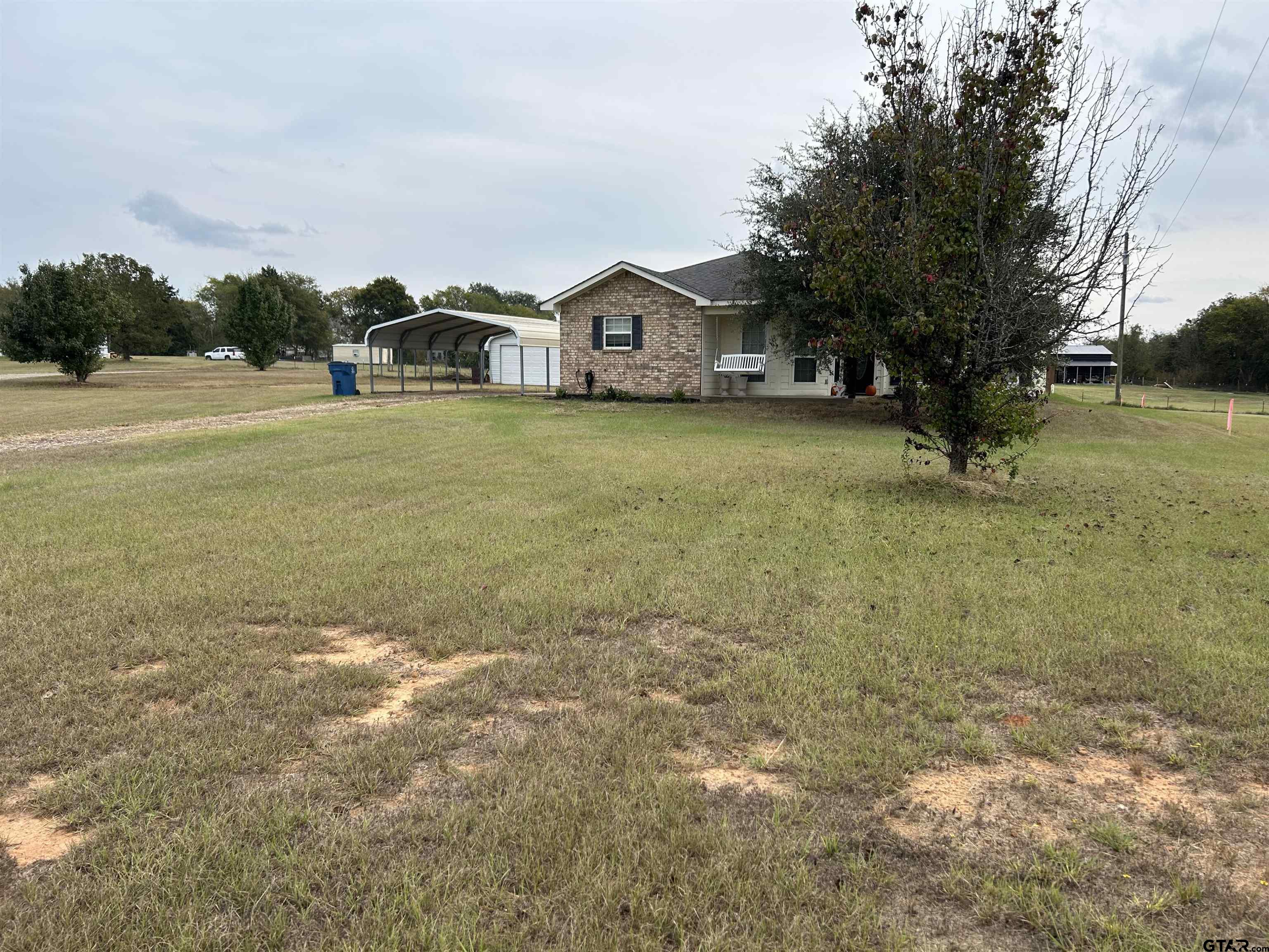508 County Road 2147 Troup, TX 75789 - Photo 3 of 24 a view of a house with a yard