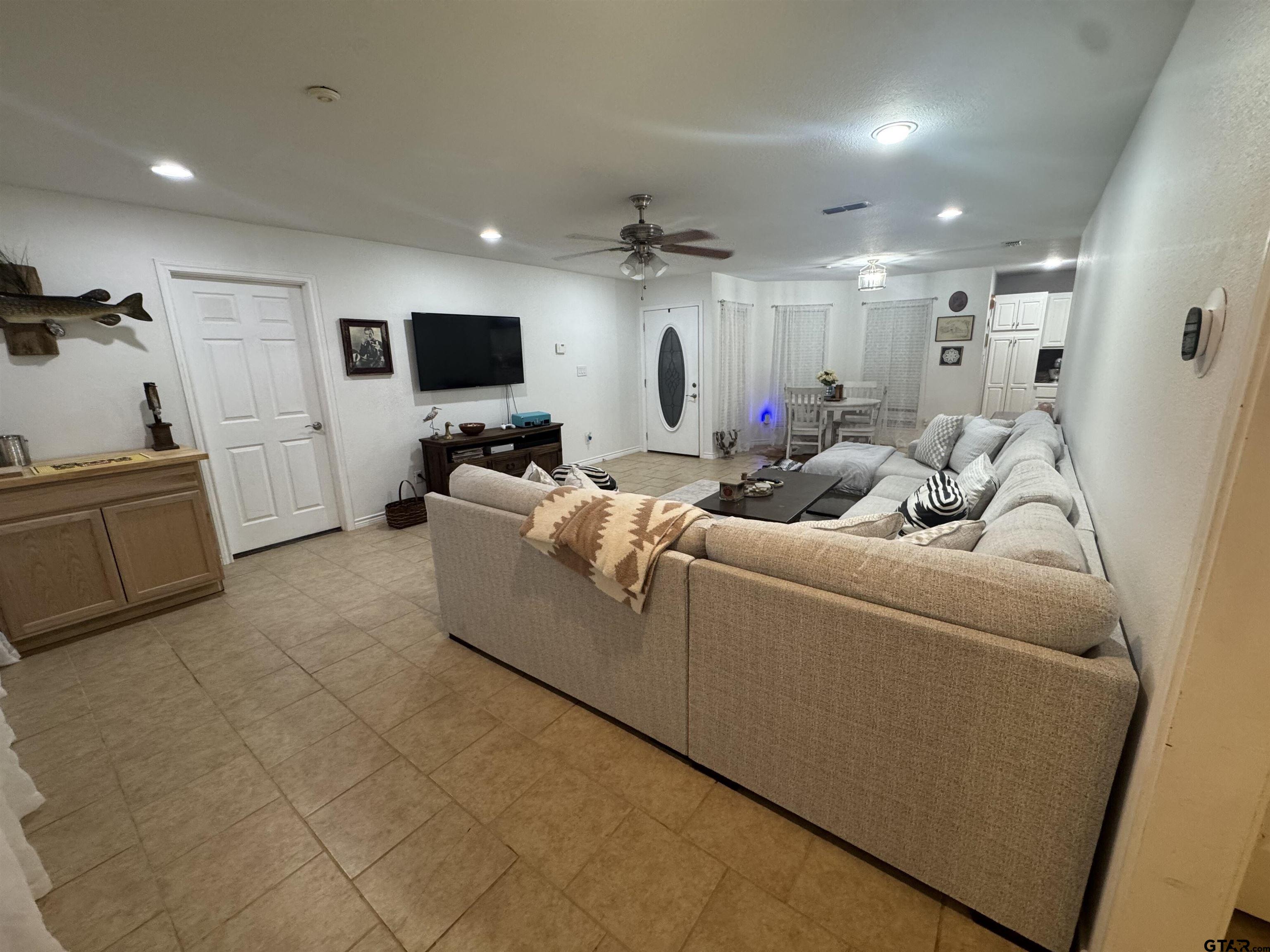 508 County Road 2147 Troup, TX 75789 - Photo 5 of 24 a living room with furniture and a flat screen tv