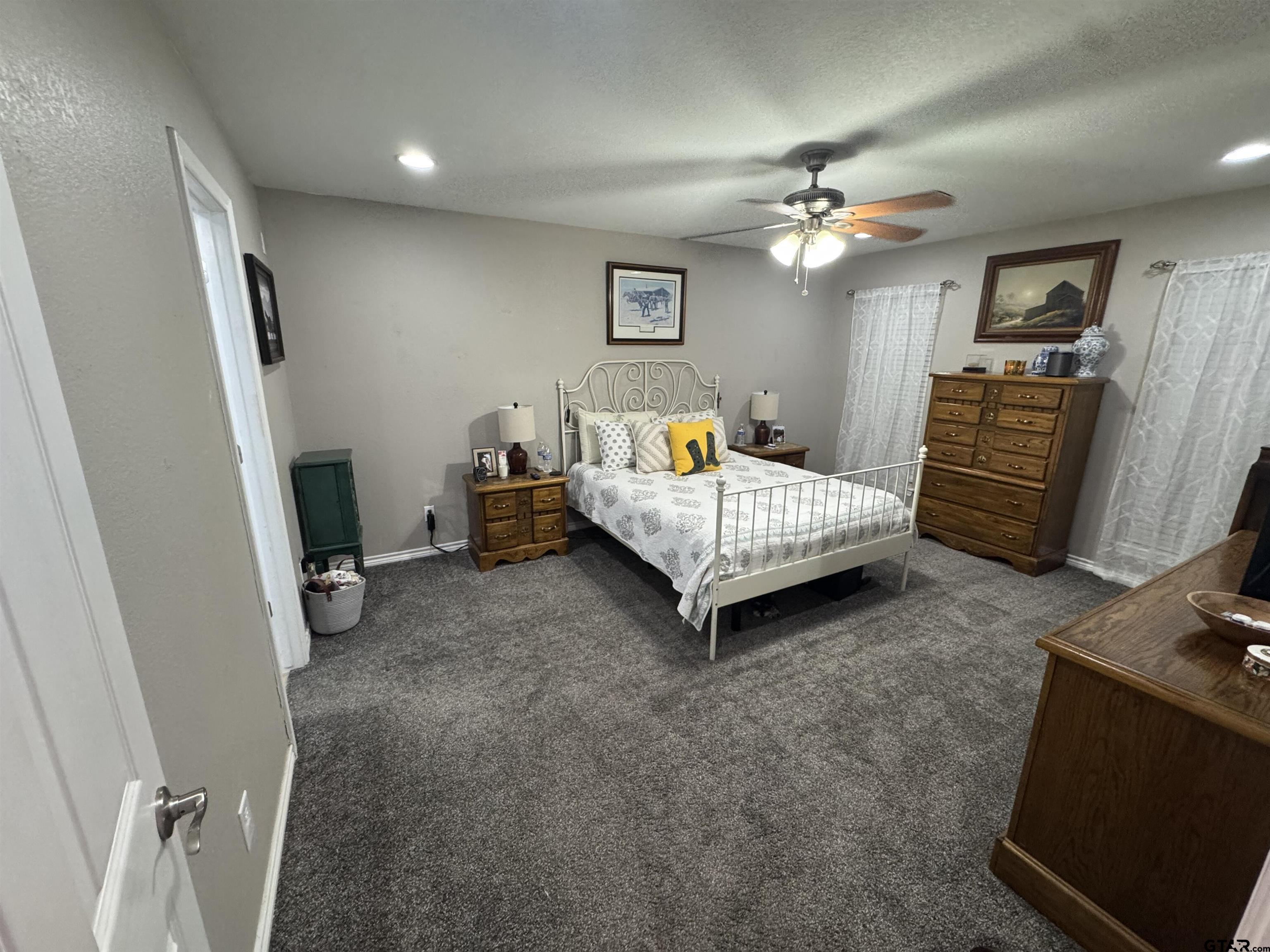 508 County Road 2147 Troup, TX 75789 - Photo 10 of 24 a bedroom with furniture and a flat screen tv