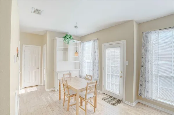 a view of a room with furniture and windows