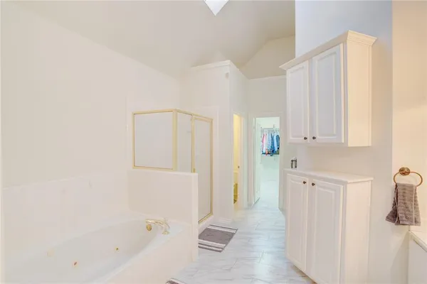 a bathroom with a bathtub and shower