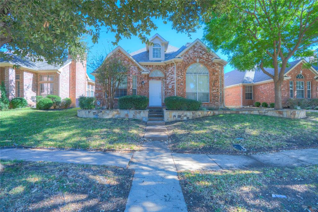 9504 Rodeo Drive Irving, TX 75063 - Photo 2 of 35 a front view of house with yard and green space