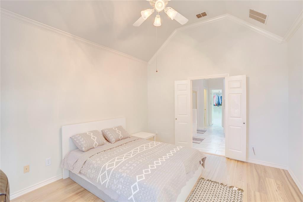 9504 Rodeo Drive Irving, TX 75063 - Photo 27 of 35 a bedroom with a bed and a mirror