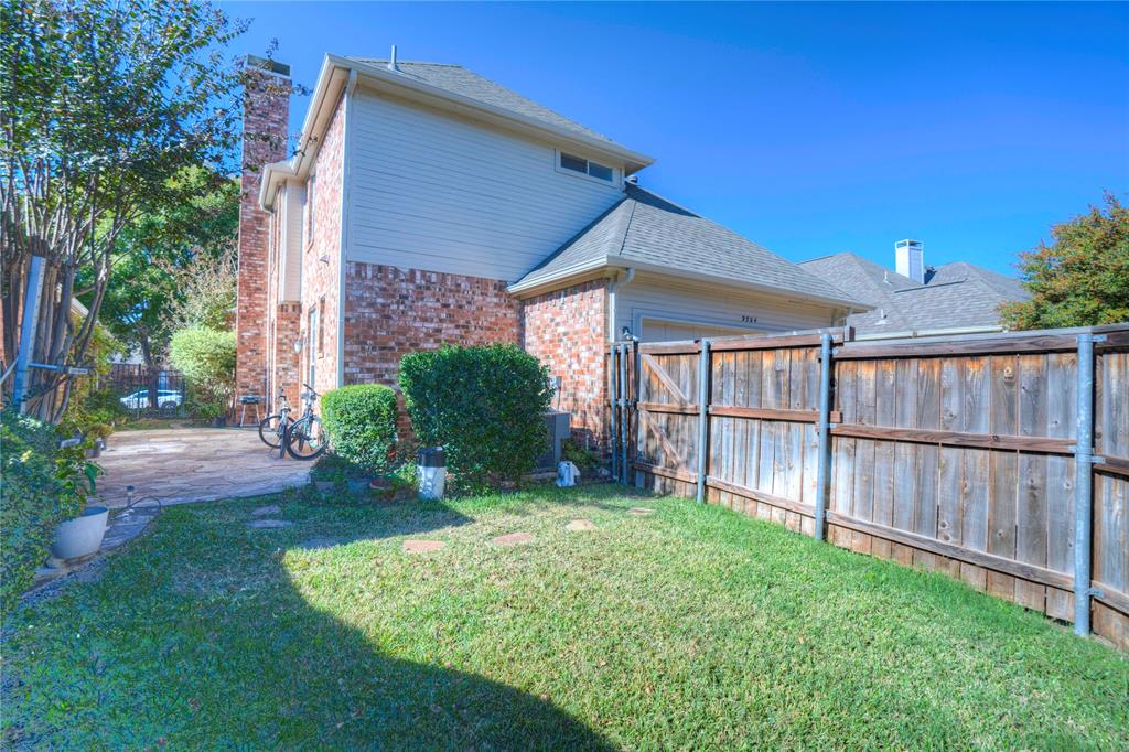 9504 Rodeo Drive Irving, TX 75063 - Photo 33 of 35 a view of a backyard with plants and large tree
