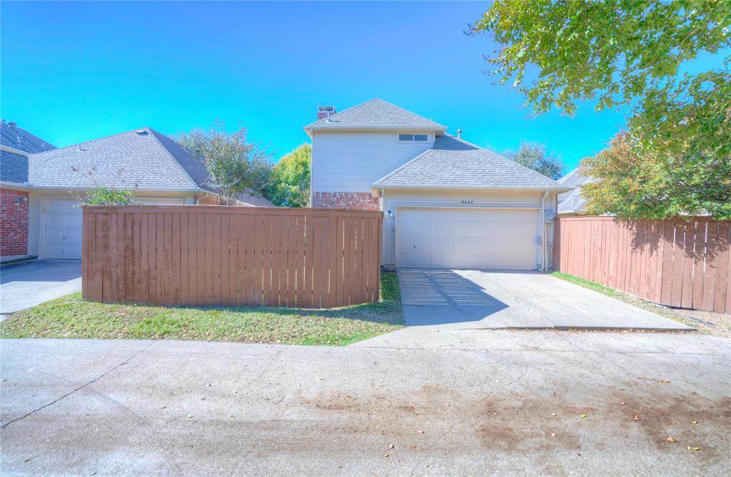 9504 Rodeo Drive Irving, TX 75063 - Photo 35 of 35 a front view of a house with a yard and garage