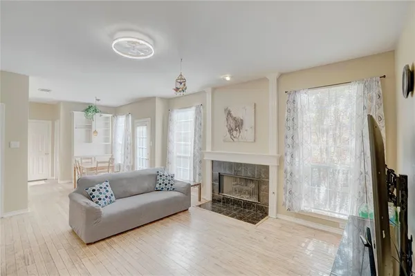 a living room with furniture and a fireplace
