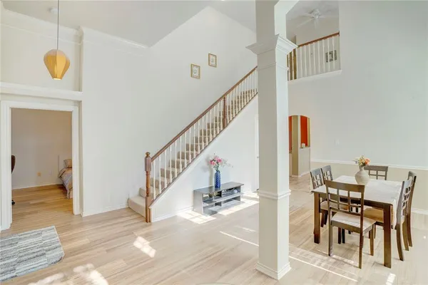 a view of a livingroom with furniture and stairs