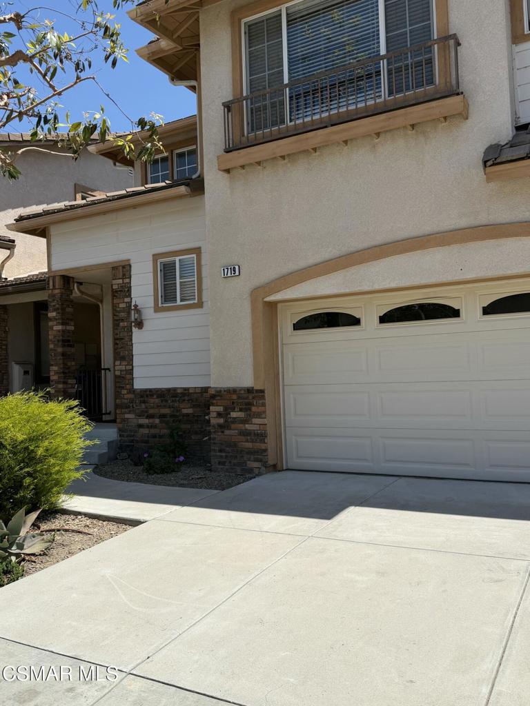 1719 Watercrest Way Simi Valley, CA 93065 - Photo 1 of 26 a front view of a house with garage