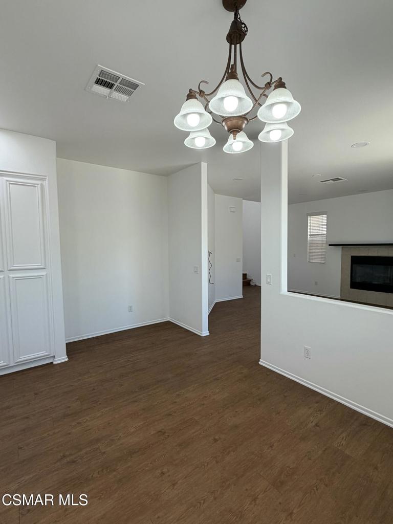 1719 Watercrest Way Simi Valley, CA 93065 - Photo 5 of 26 a view of a chandelier fan and wooden floor