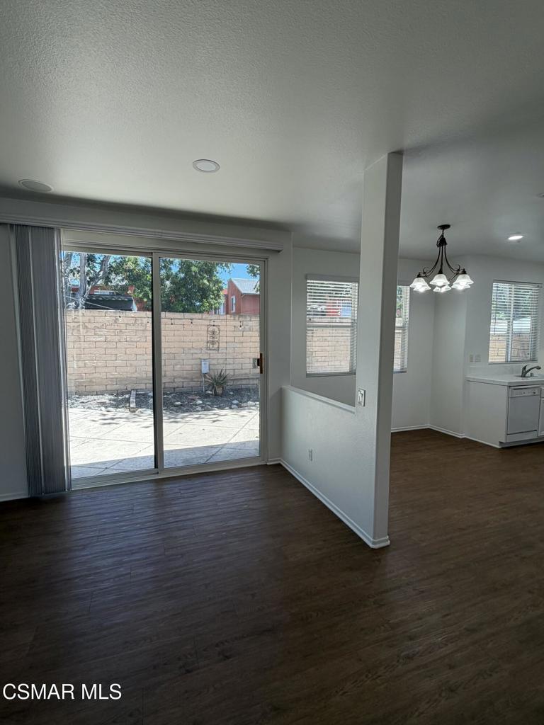 1719 Watercrest Way Simi Valley, CA 93065 - Photo 6 of 26 an empty room with wooden floor and windows