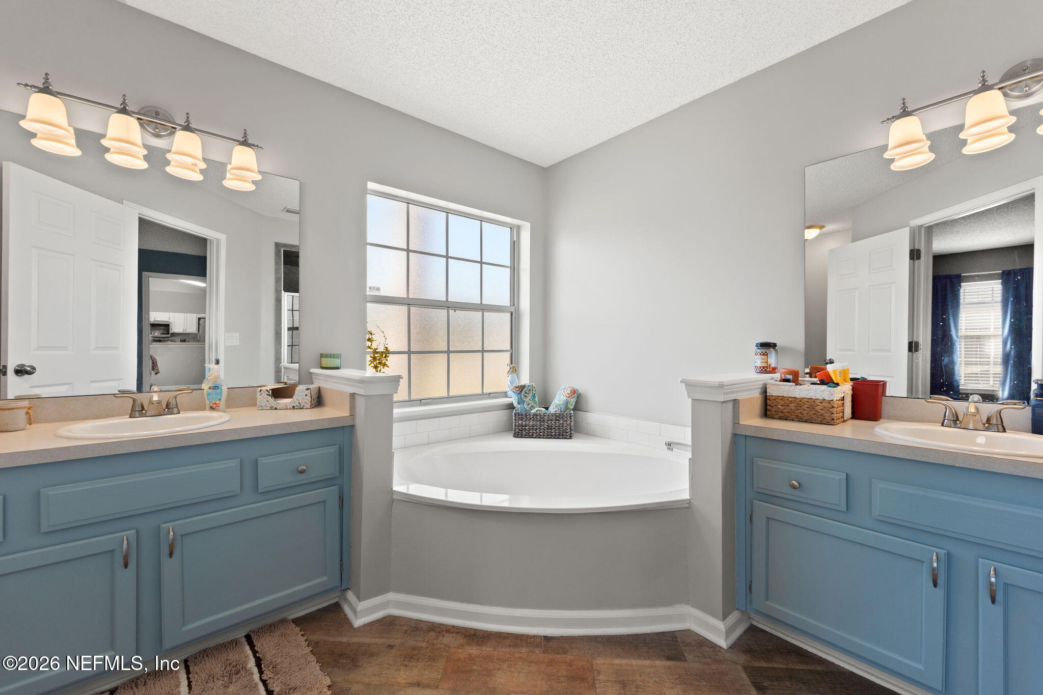 2982 Chief Ridaught Trail Middleburg, FL 32068 - Photo 1 of 29 a bathroom with a sink double vanity granite and a mirror