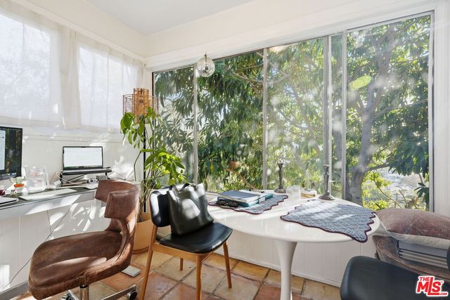 a view of a dining room with furniture window and outside view