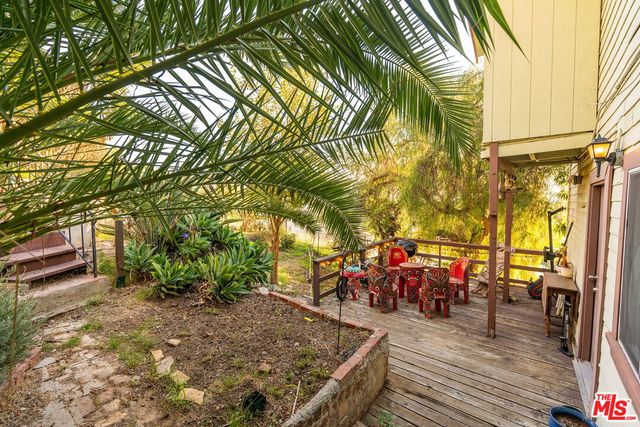 a kitchen with refrigerator and window