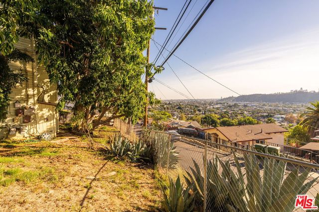 a view of building with yard