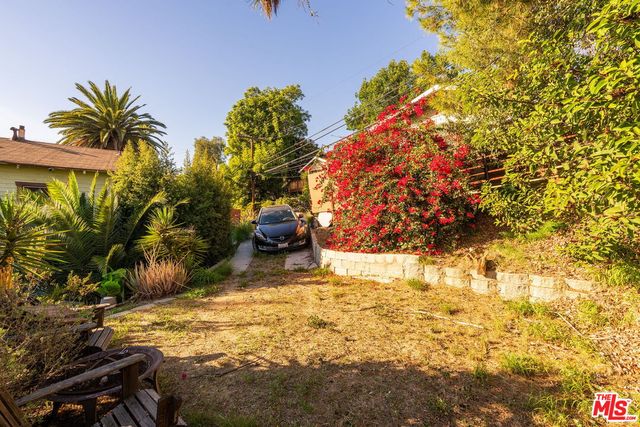 a backyard of a house with lots of green space