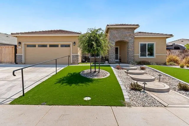 a view of a patio with table and chairs with wooden fence