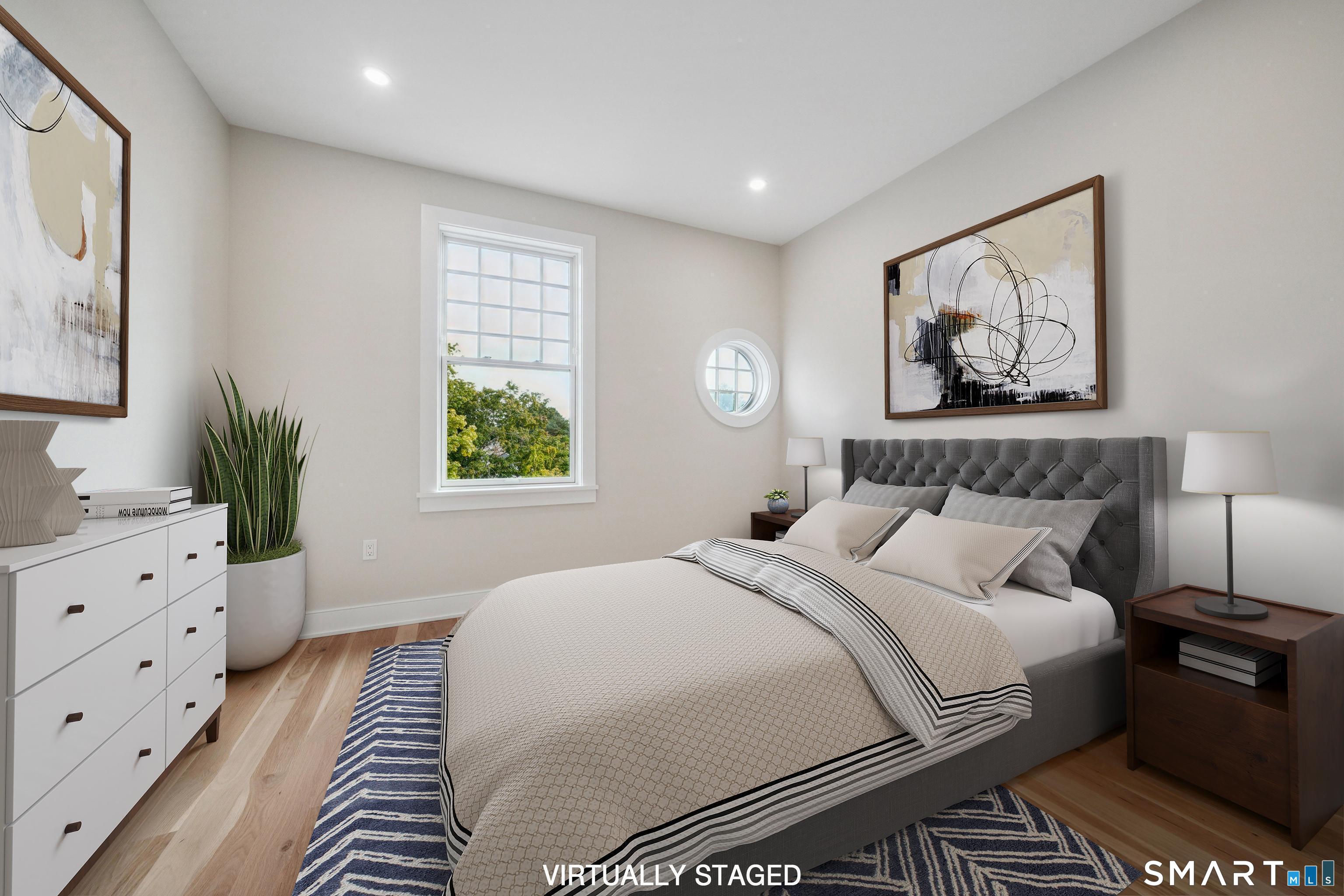 8 Husted Lane, Unit 2D New Canaan, CT 06840 - Photo 11 of 18 a bedroom with a large bed and a window