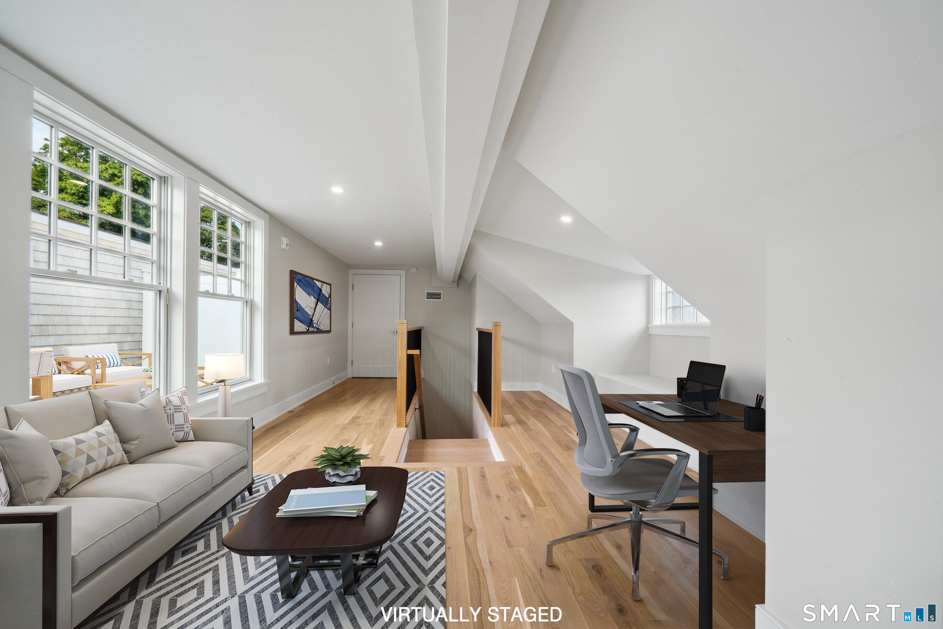 8 Husted Lane, Unit 2D New Canaan, CT 06840 - Photo 14 of 18 a living room with furniture and a large window