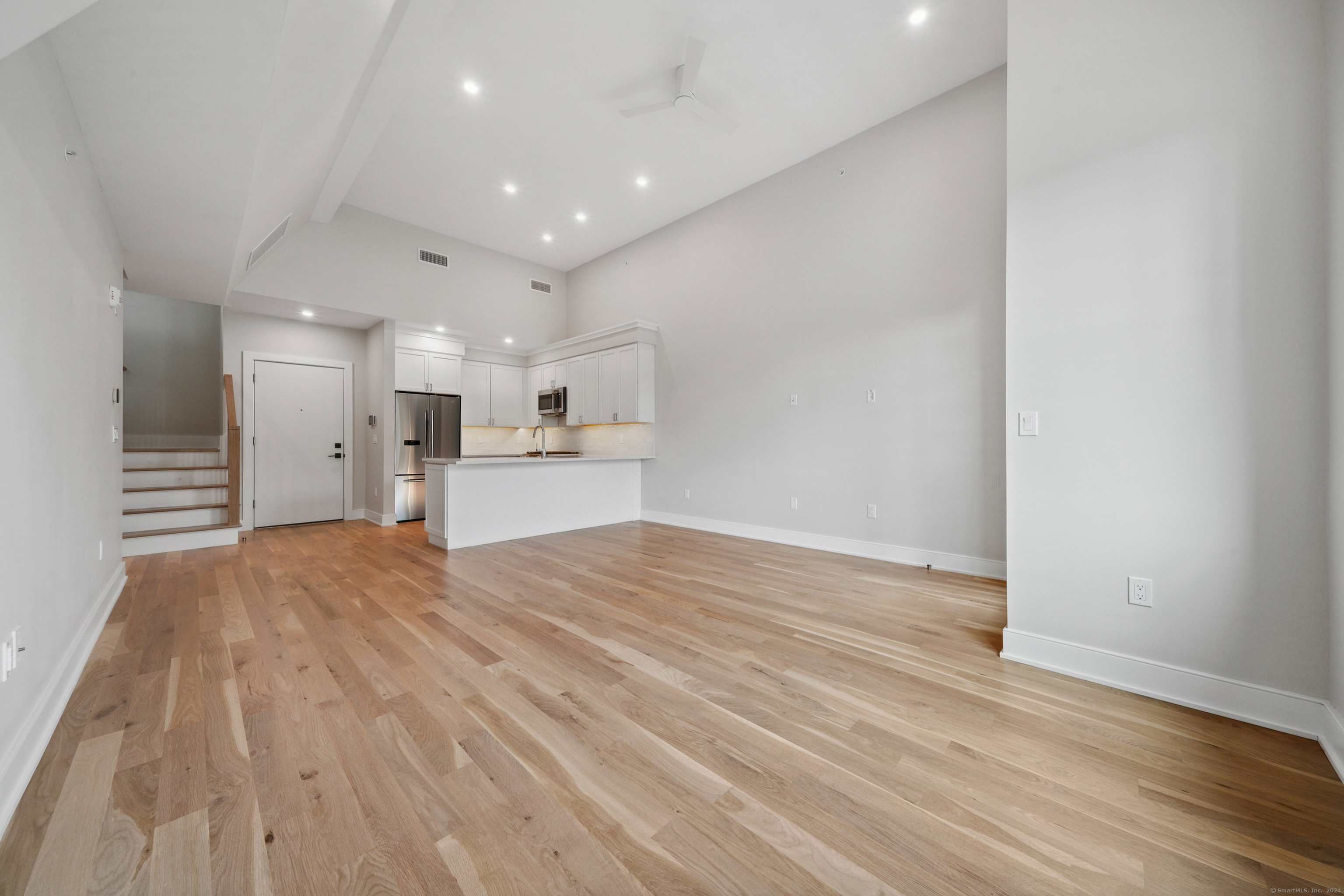 8 Husted Lane, Unit 2D New Canaan, CT 06840 - Photo 5 of 18 a view of kitchen with wooden floor