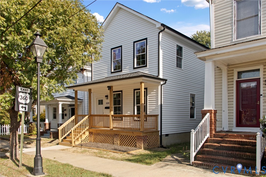 1430 Decatur Street Richmond, VA 23224 - Photo 2 of 37 White siding exterior with black trim windows, cov