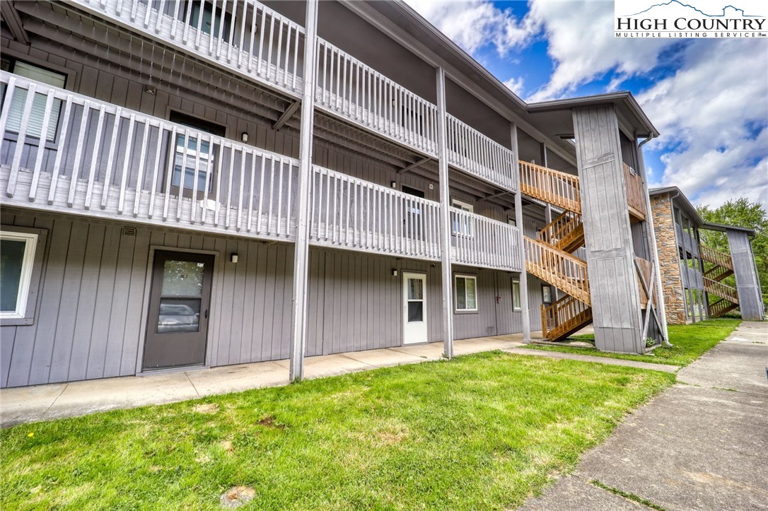 128 Zeb Street, Unit A304 Boone, NC 28607 - Photo 24 of 27 a front view of a house with a garden and plants