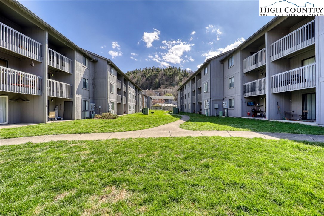 128 Zeb Street, Unit A304 Boone, NC 28607 - Photo 26 of 27 a view of a house with a yard and front of a house