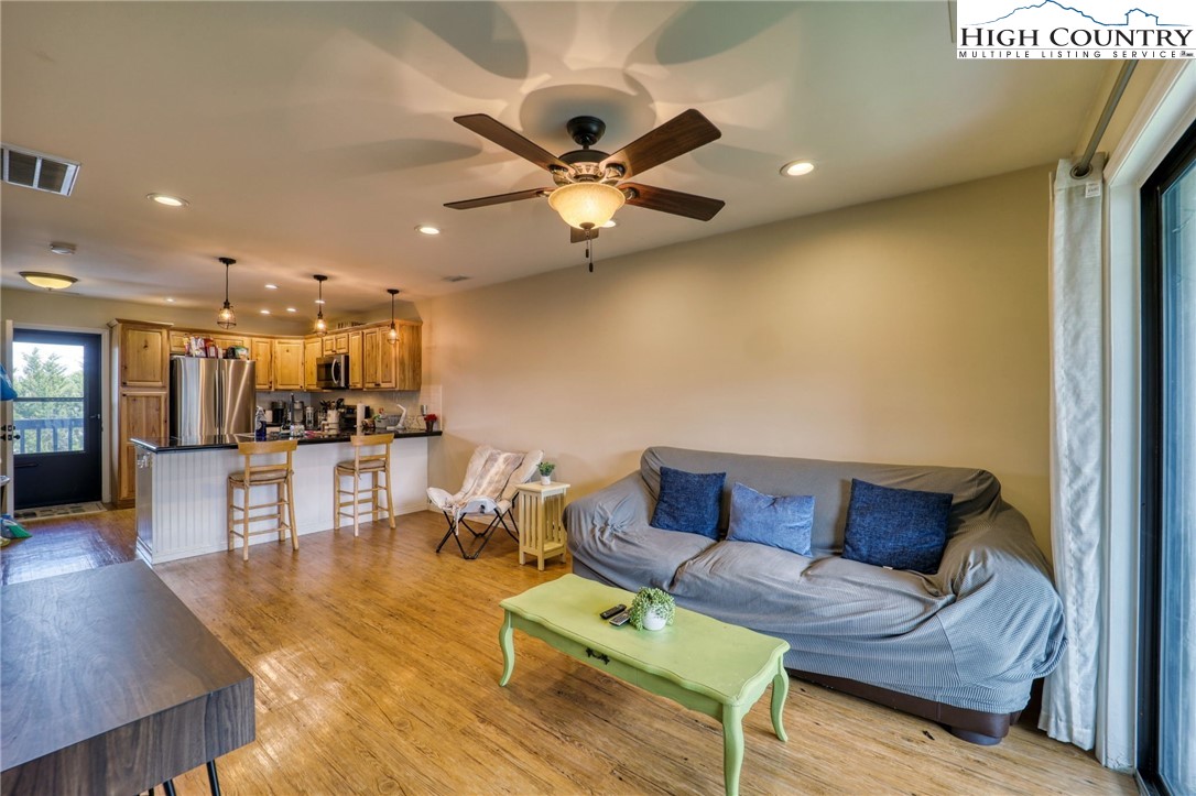 128 Zeb Street, Unit A304 Boone, NC 28607 - Photo 3 of 27 a living room with furniture and kitchen view