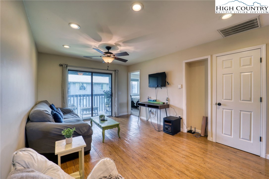 128 Zeb Street, Unit A304 Boone, NC 28607 - Photo 5 of 27 a living room with furniture and a large window