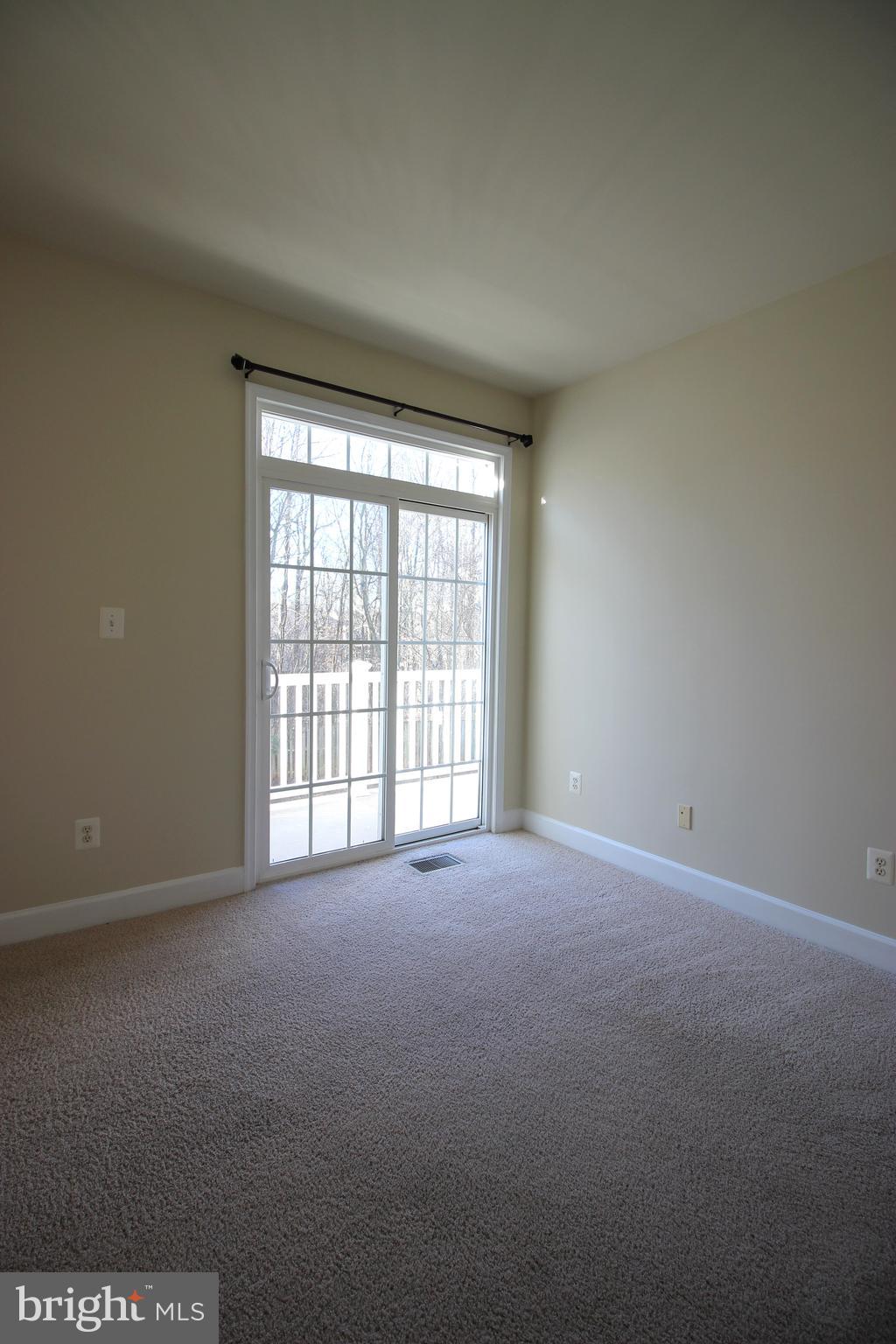 13608 Dover Cliffs Place Germantown, MD 20874 - Photo 13 of 32 a view of an empty room with a window