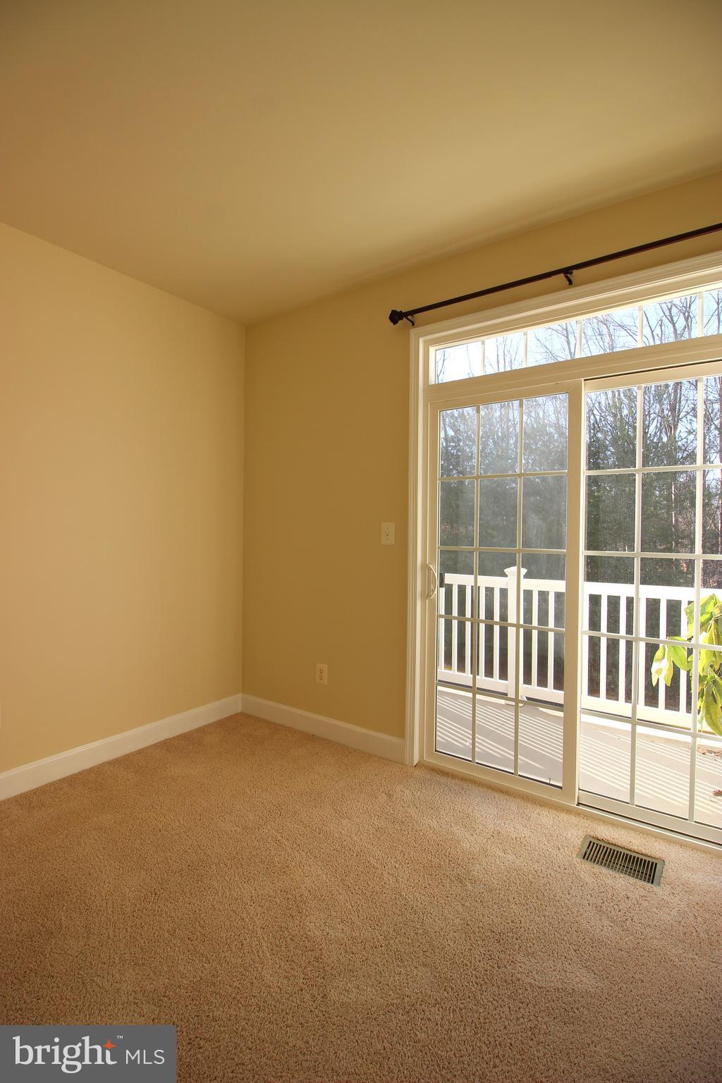 13608 Dover Cliffs Place Germantown, MD 20874 - Photo 20 of 32 a view of an empty room with a window