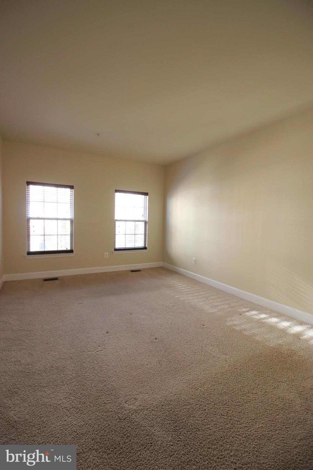13608 Dover Cliffs Place Germantown, MD 20874 - Photo 21 of 32 an empty room with windows