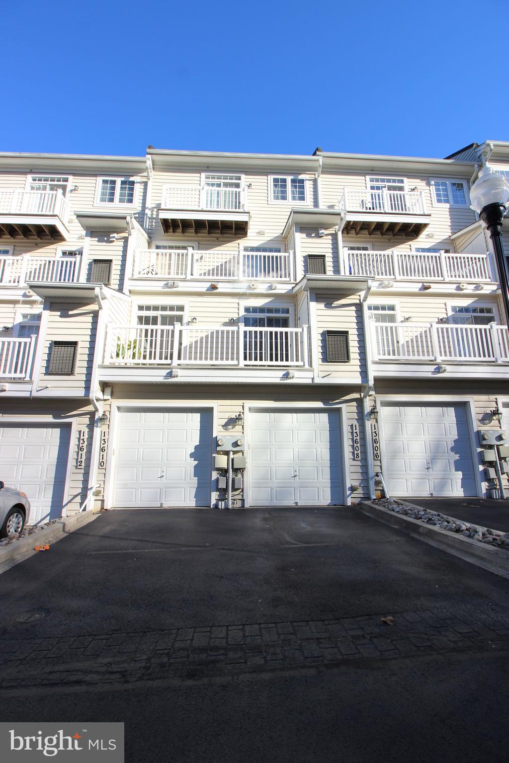 13608 Dover Cliffs Place Germantown, MD 20874 - Photo 32 of 32 a front view of a building with glass windows