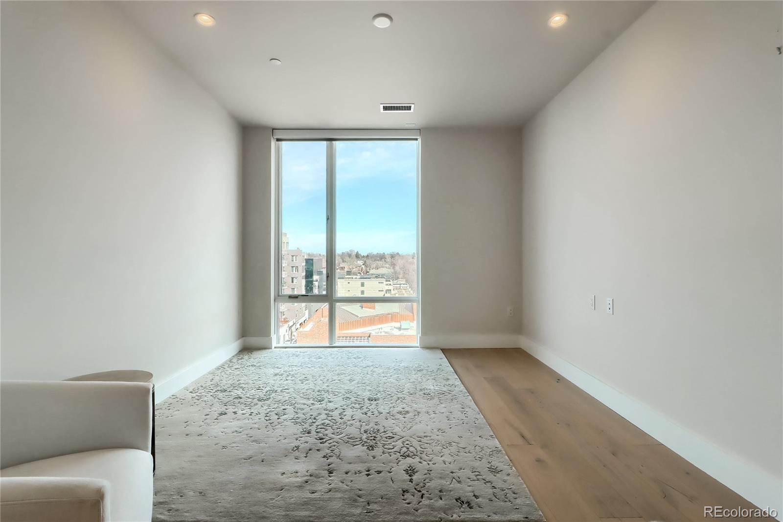 155 Steele Street, Unit 814 Denver, CO 80206 - Photo 18 of 39 a view of an empty room and window