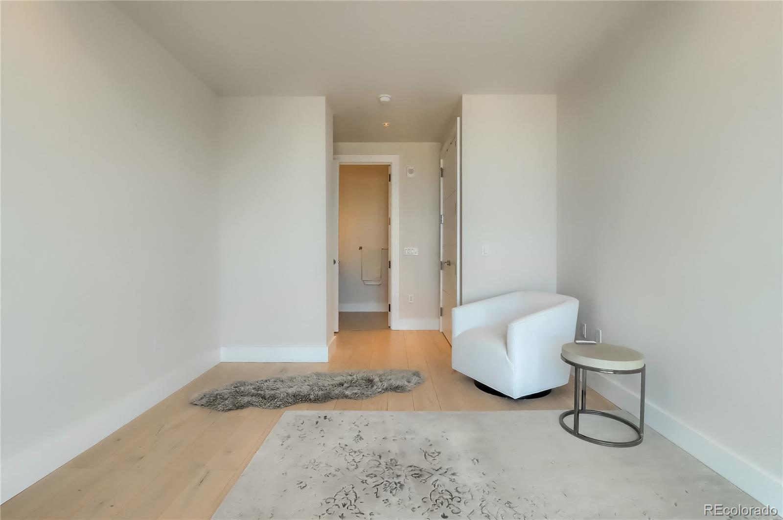 155 Steele Street, Unit 814 Denver, CO 80206 - Photo 19 of 39 a bathroom with a sink and toilet