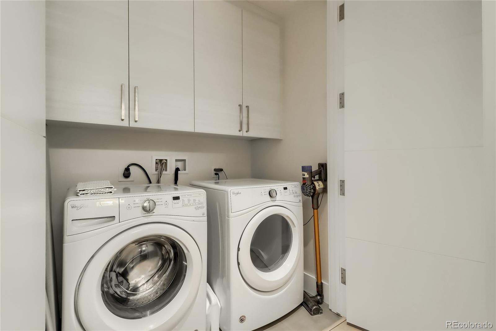 155 Steele Street, Unit 814 Denver, CO 80206 - Photo 24 of 39 a utility room with dryer and washer