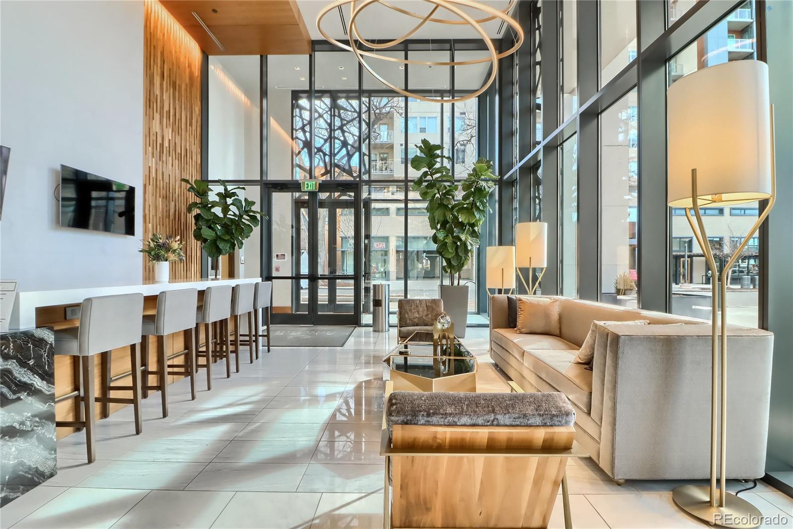 155 Steele Street, Unit 814 Denver, CO 80206 - Photo 26 of 39 a living room with couches a coffee table and next to a window