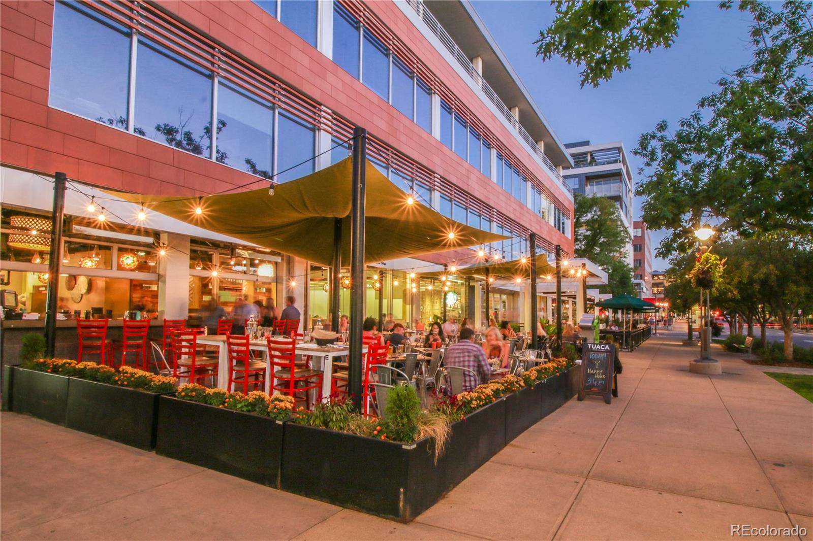 155 Steele Street, Unit 814 Denver, CO 80206 - Photo 33 of 39 a view of group of people sitting in front of retail shops