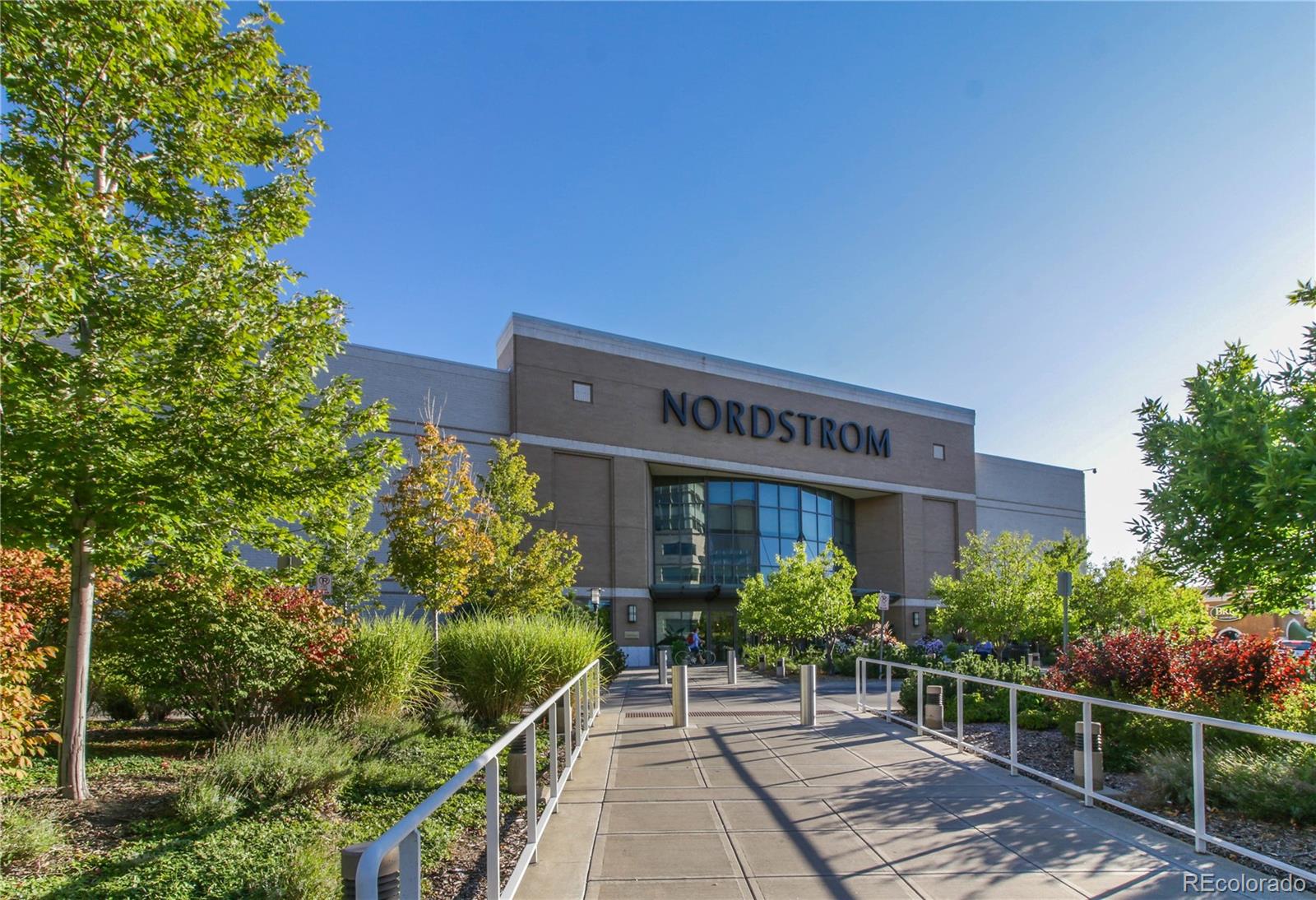 155 Steele Street, Unit 814 Denver, CO 80206 - Photo 35 of 39 a view of a house with plants and a flower garden