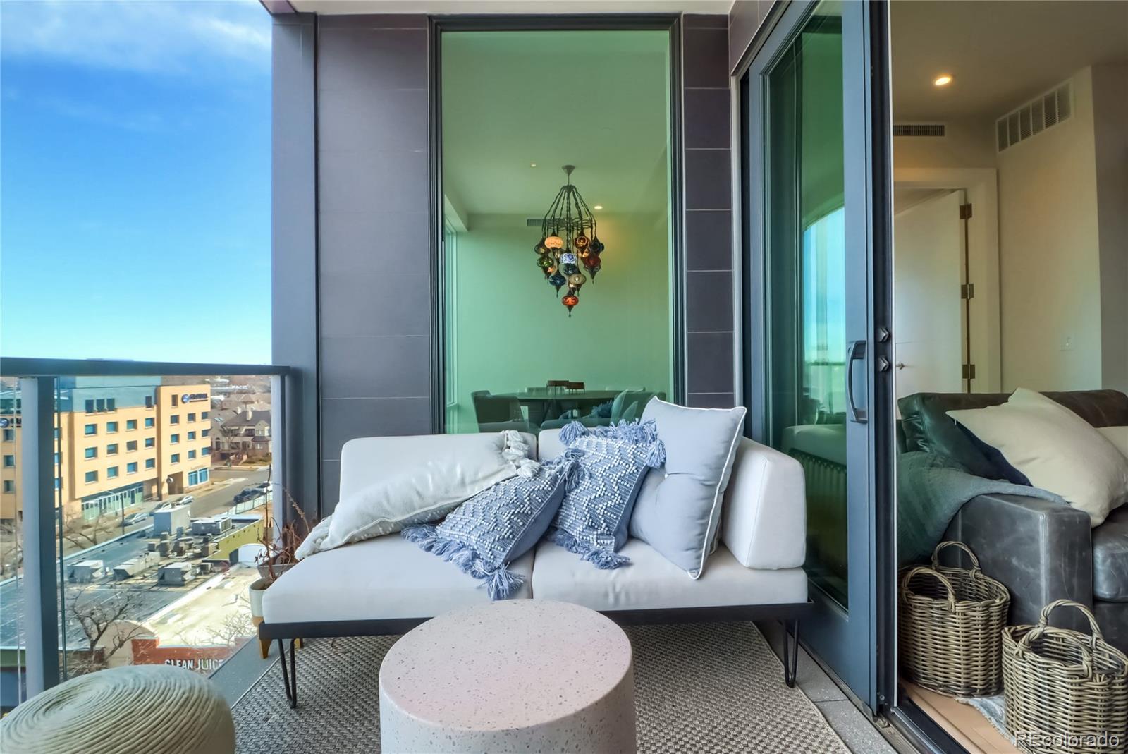 155 Steele Street, Unit 814 Denver, CO 80206 - Photo 5 of 39 a living room with furniture and a window